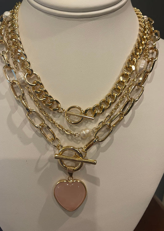 Multi layer Fashion 3 set gold tone necklace.